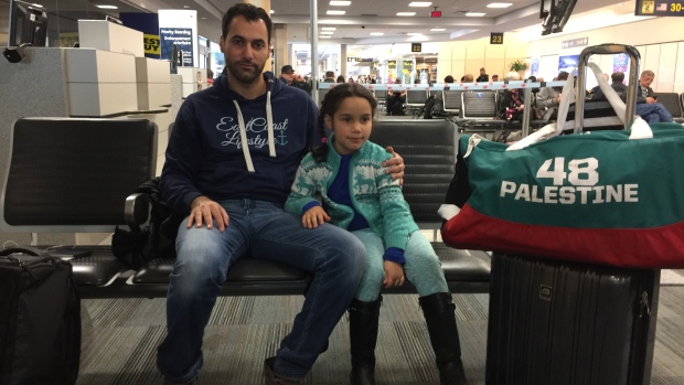 Ahmad Hussein and his six-year-old daughter Mariam, who was not allowed to fly on Air Canada because her father had signed her passport.
