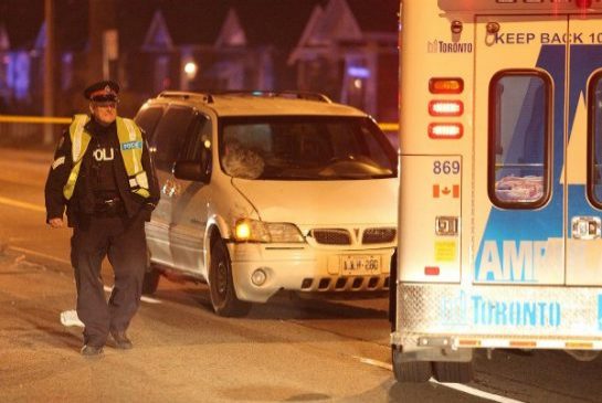 Police investigate the scene of a fatal pedestrian struck accident on Lawrence Avenue West near Jane Street on Nov. 11, 2013.