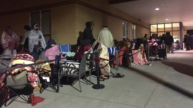 Parents have been lining up for hours in the freezing cold outside a Catholic high school in Brampton in the hopes of registering their children for public school spots.