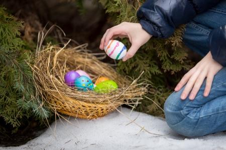 depositphotos_66162844-stock-photo-little-girl-putting-easter-egg.jpg
