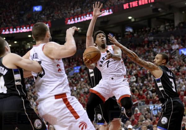 Toronto Raptors guard Kyle Lowry (7) drives to the net under pressure from Milwaukee Bucks guard George Hill (3)during second half NBA Eastern Conference finals action in Toronto on Saturday, May 25, 2019. THE CANADIAN PRESS/Nathan Denette