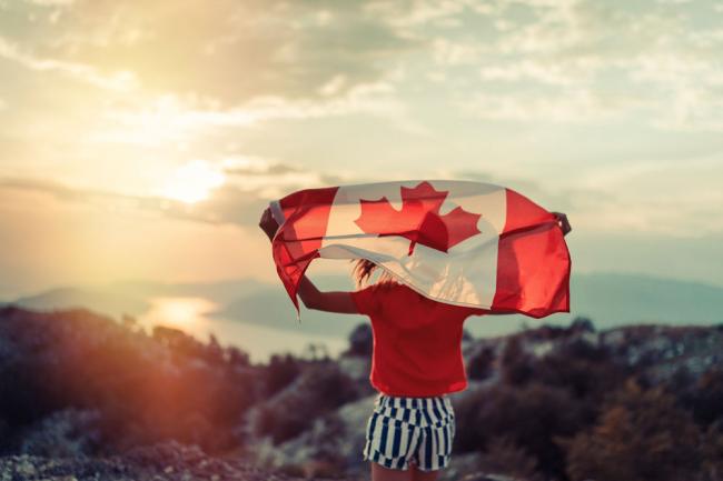girl-carrying-canadian-flag.jpg