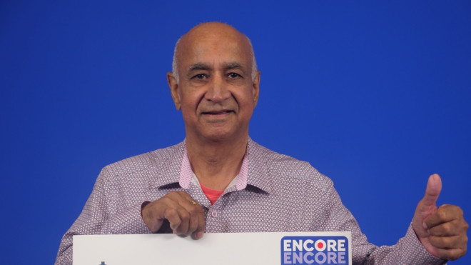 Surinderjit Dehal is seen holding his prize in Toronto (OLG). 