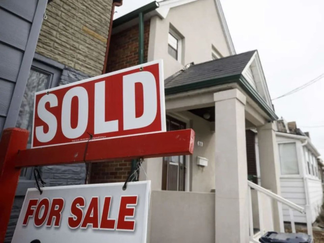 Last week, Toronto police asked the public for help after a pair of homeowners returned to Canada to find their home sold without their knowledge in 2022. CBC News has learned that wasn't an isolated case. (Cole Burston/Bloomberg - image credit)